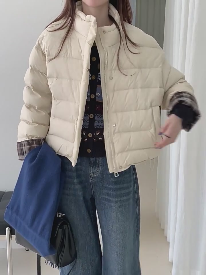 穿上这件羽绒服，我仿佛成了行走的暖宝宝，但钱包在哭泣